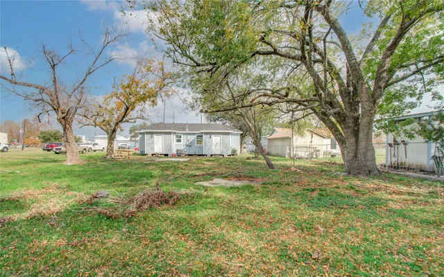 a view of house with yard