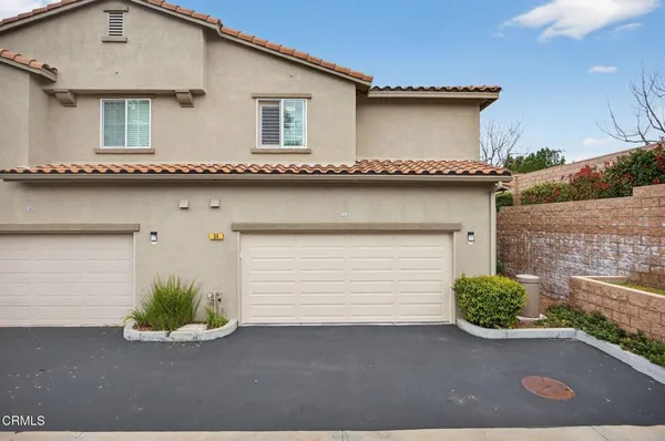 a front view of a house with a garage