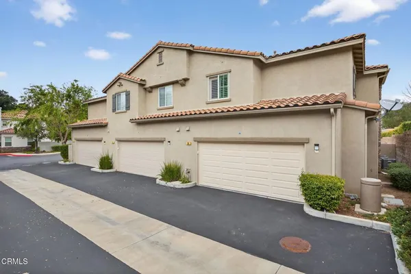 a front view of a house with a garage
