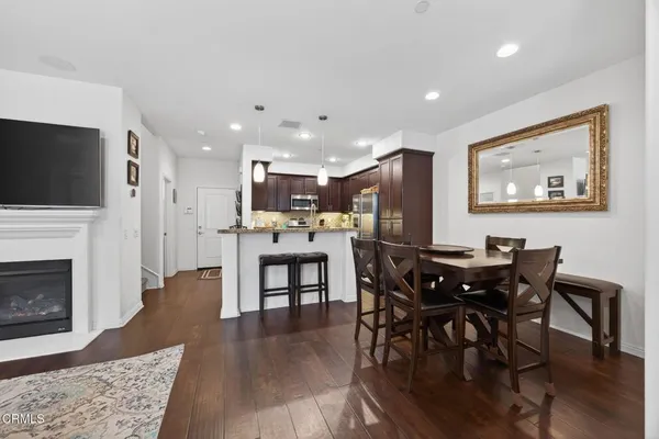 a view of kitchen with dining table and chairs