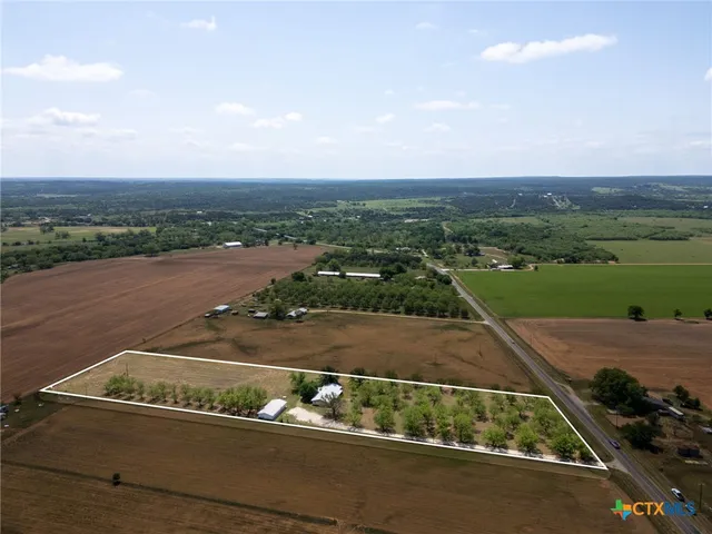 an aerial view of multiple houses with outdoor space