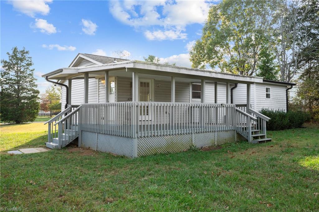 8440 West Harrell Road Oak Ridge, NC 27310 - Photo 22 of 50 Covered porch and large level yard