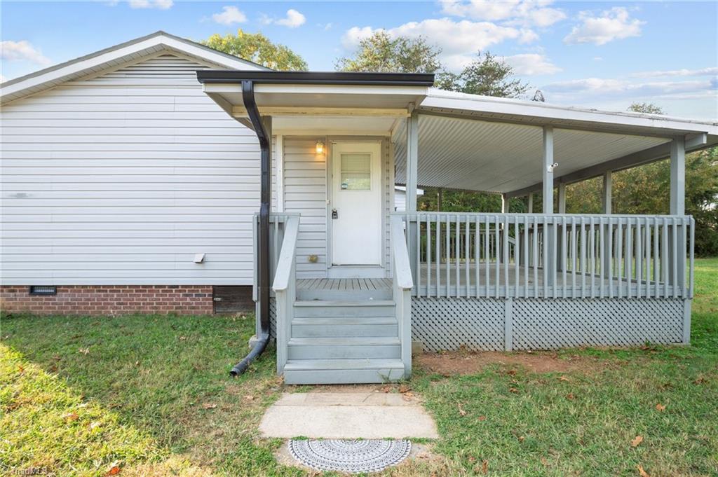 8440 West Harrell Road Oak Ridge, NC 27310 - Photo 26 of 50 Side entry door, has small area just inside for drop zone