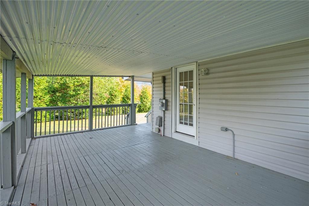 8440 West Harrell Road Oak Ridge, NC 27310 - Photo 4 of 50 Spacious covered porch