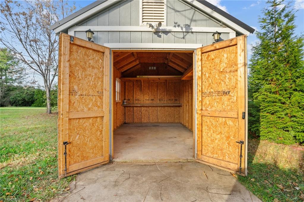 8440 West Harrell Road Oak Ridge, NC 27310 - Photo 45 of 50 Storage building with electricity, perfect for She Shed or man cave