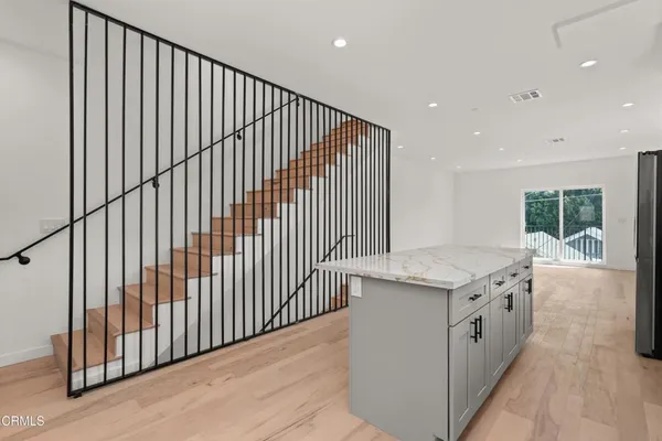 a kitchen with a sink and cabinets