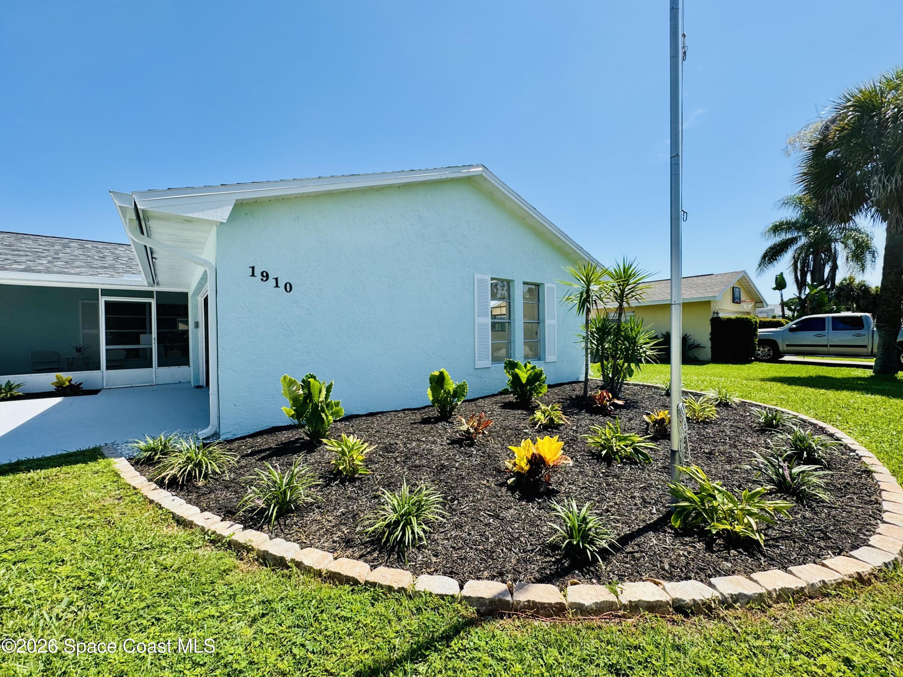 1910 Tallridge Road Melbourne, FL 32935 - Photo 25 of 34 Front Yard Landscaping