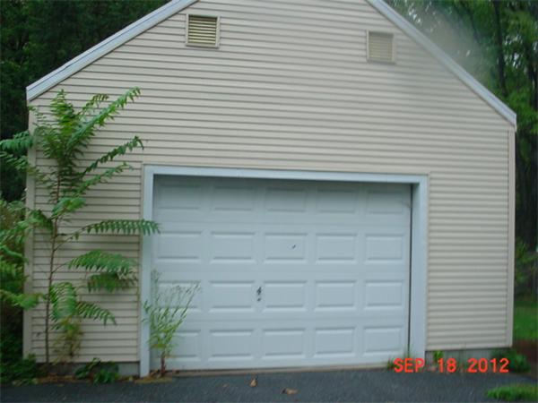 28 Whittaker Street Springfield, MA 01104 - Photo 4 of 6 a front view of a house with garage