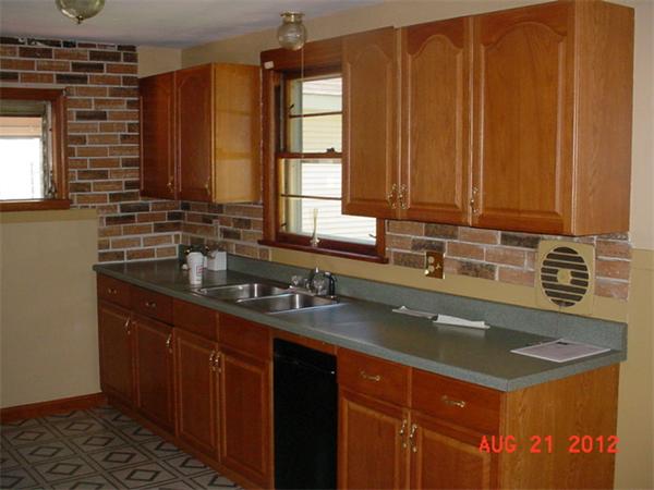 28 Whittaker Street Springfield, MA 01104 - Photo 5 of 6 a kitchen with stainless steel appliances a sink stove and cabinets