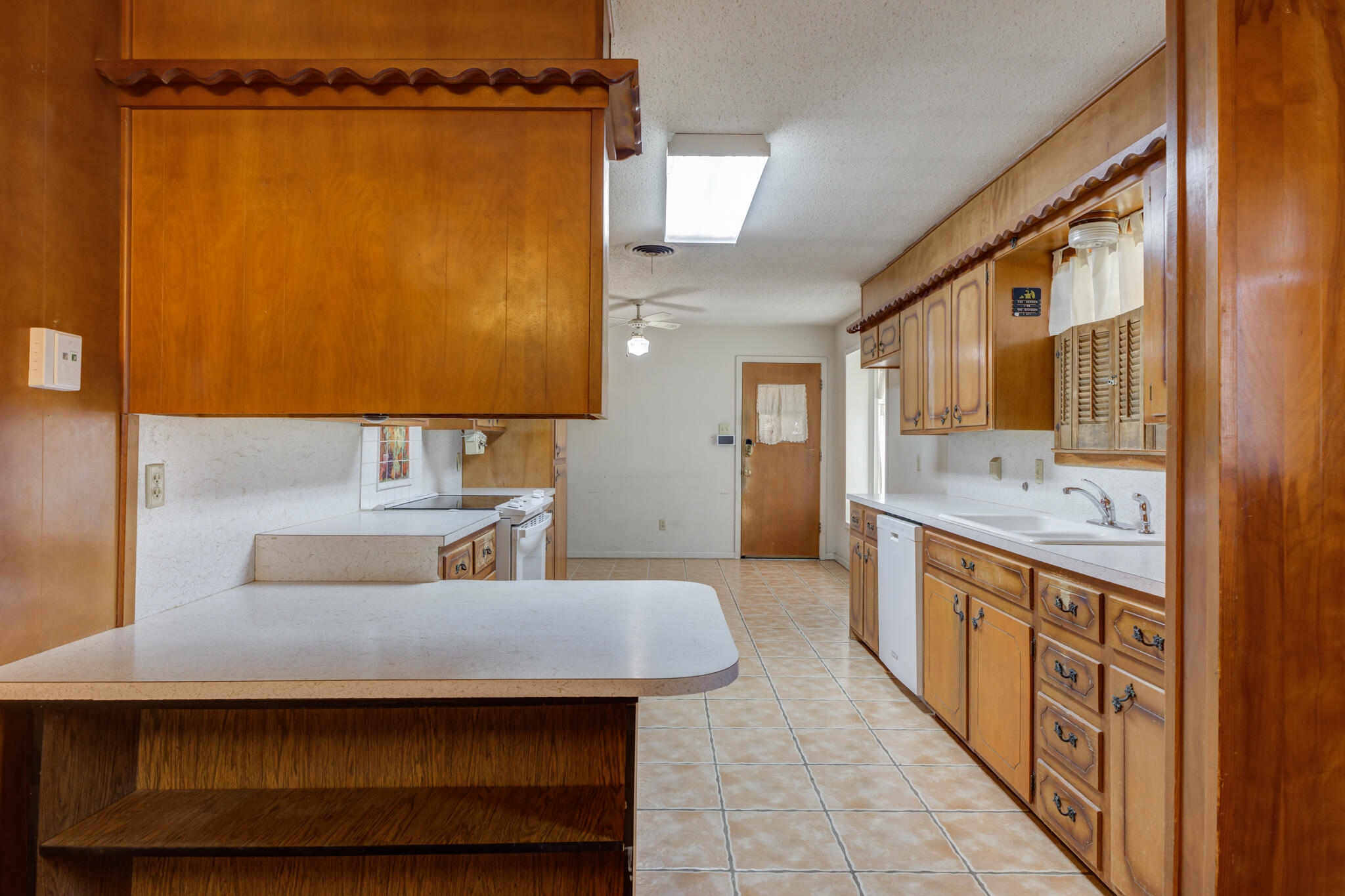 5502 8th Street Lubbock, TX 79416 - Photo 13 of 37 a bathroom with a sink a mirror and a shower