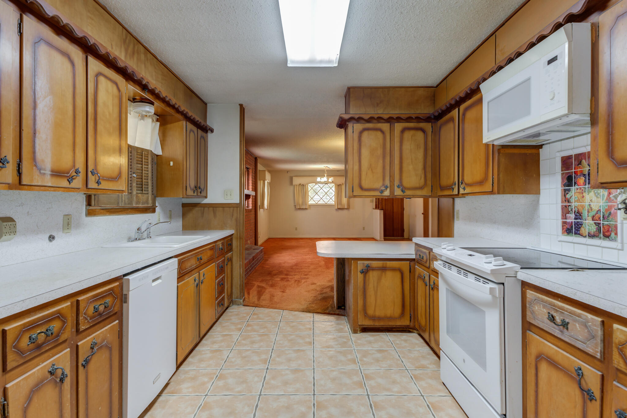 5502 8th Street Lubbock, TX 79416 - Photo 15 of 37 a kitchen with stainless steel appliances granite countertop a sink and cabinets