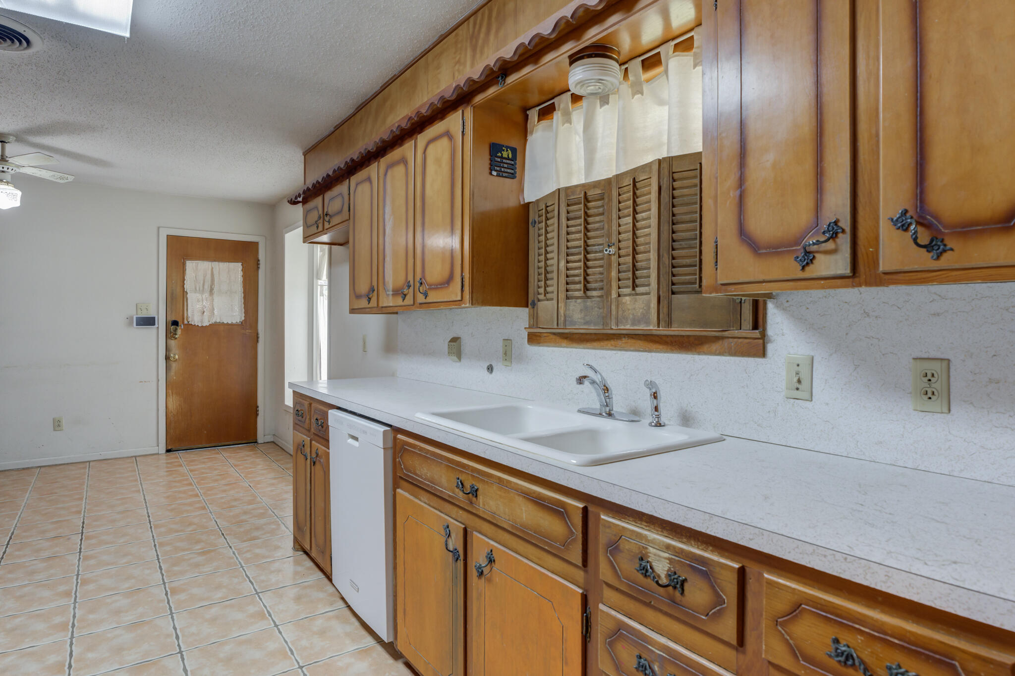 5502 8th Street Lubbock, TX 79416 - Photo 16 of 37 a bathroom with a sink and a mirror