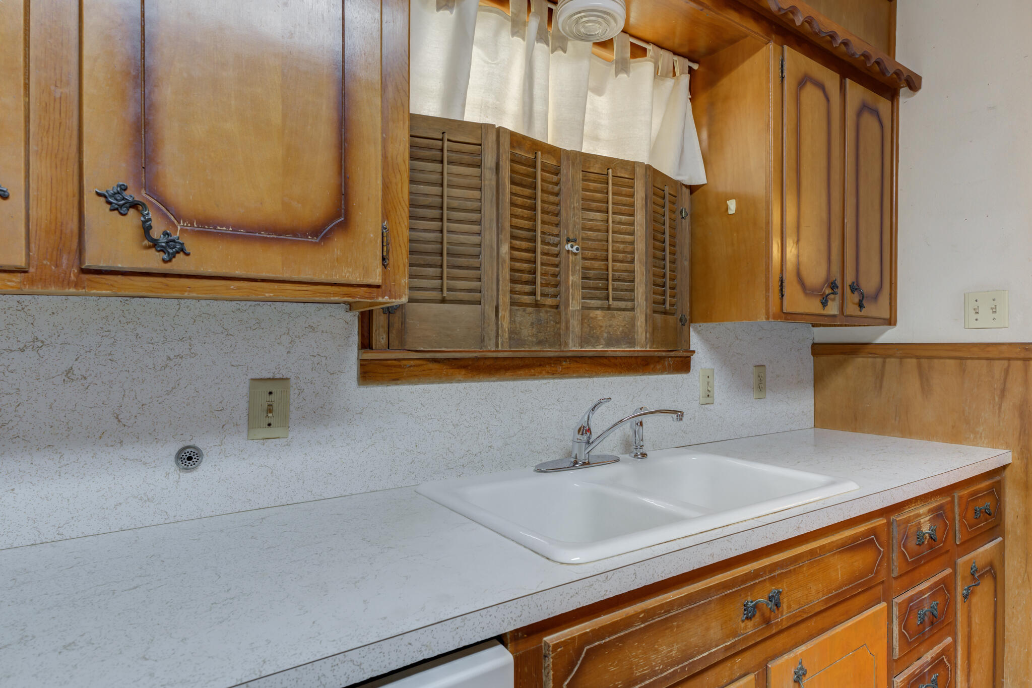 5502 8th Street Lubbock, TX 79416 - Photo 17 of 37 a bathroom with a sink and a mirror
