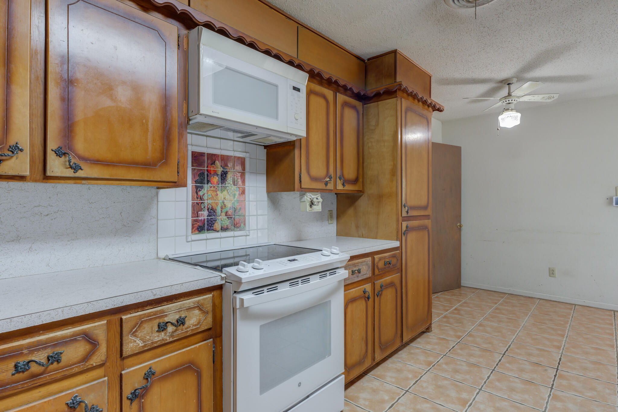 5502 8th Street Lubbock, TX 79416 - Photo 18 of 37 a kitchen with stainless steel appliances granite countertop a stove and a sink