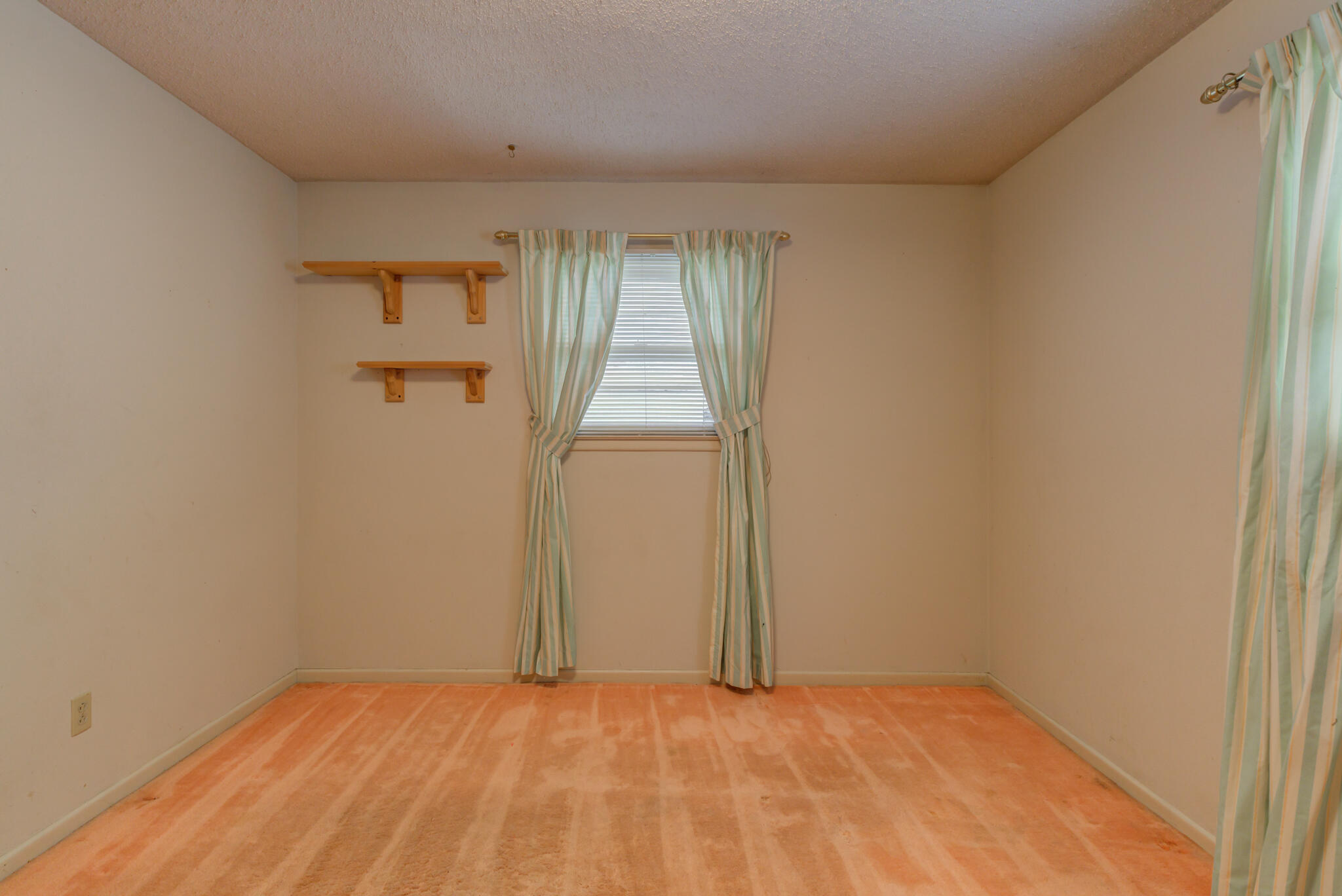 5502 8th Street Lubbock, TX 79416 - Photo 29 of 37 a view of an empty room and window