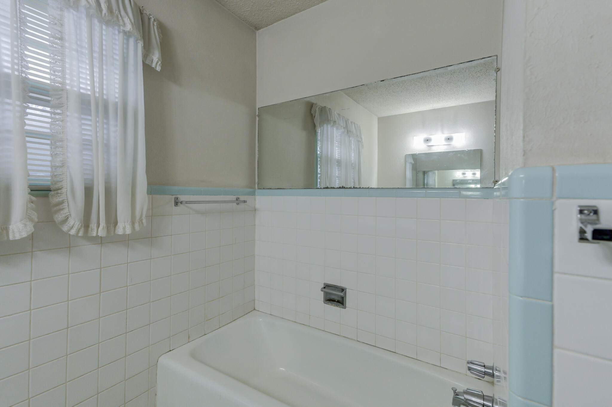 5502 8th Street Lubbock, TX 79416 - Photo 32 of 37 a bathroom with a bathtub