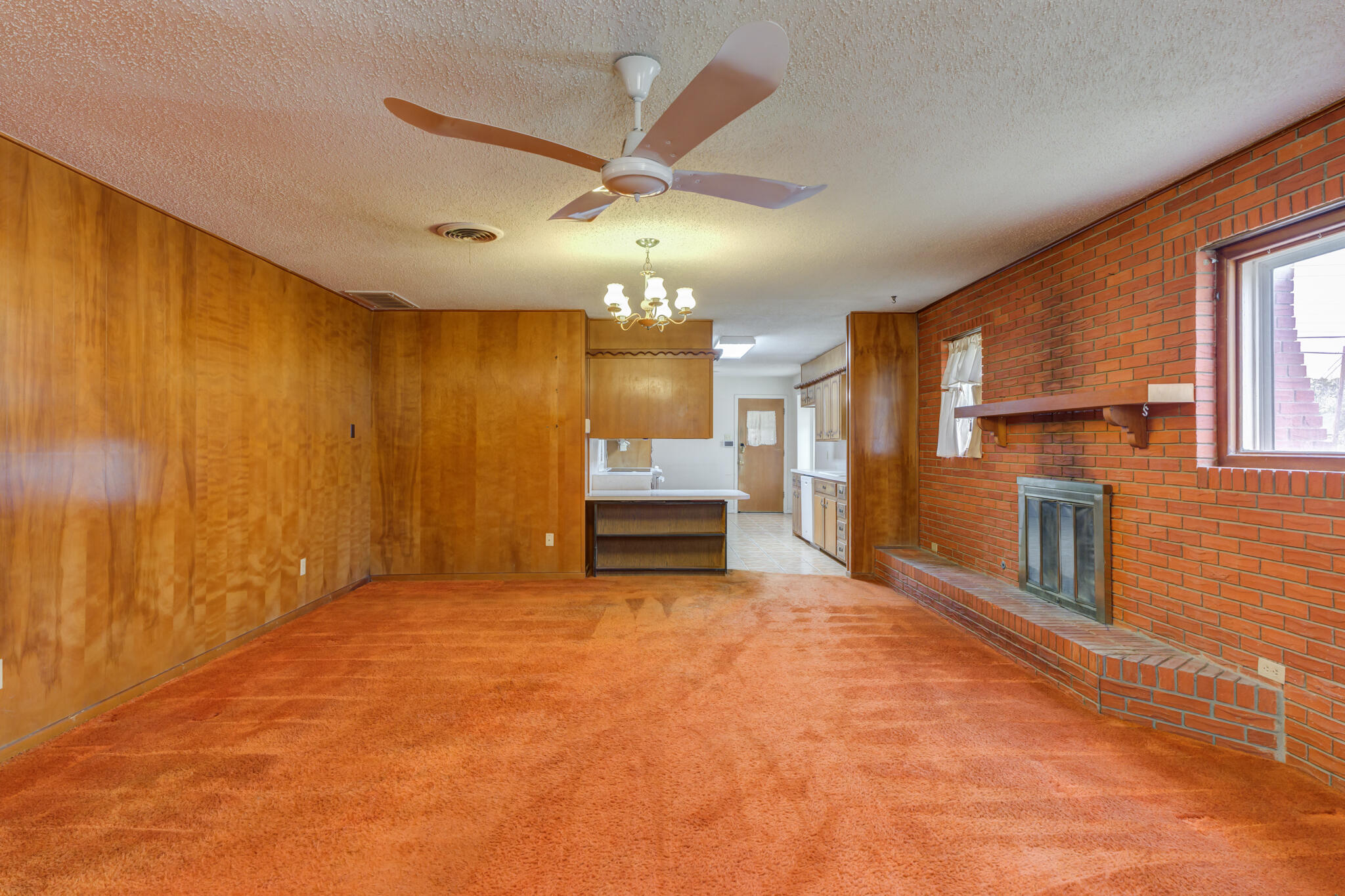 5502 8th Street Lubbock, TX 79416 - Photo 6 of 37 a view of a livingroom with a fireplace