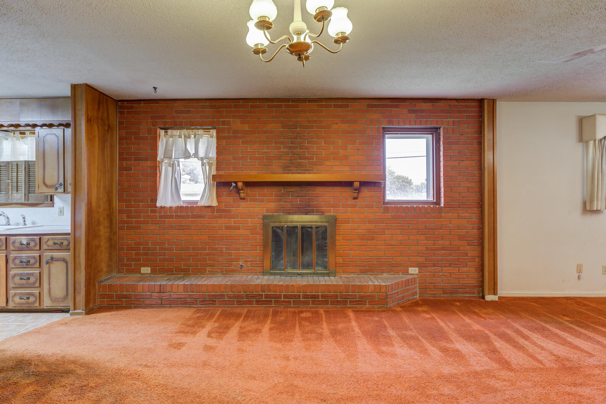 5502 8th Street Lubbock, TX 79416 - Photo 8 of 37 a view of a livingroom with a fireplace