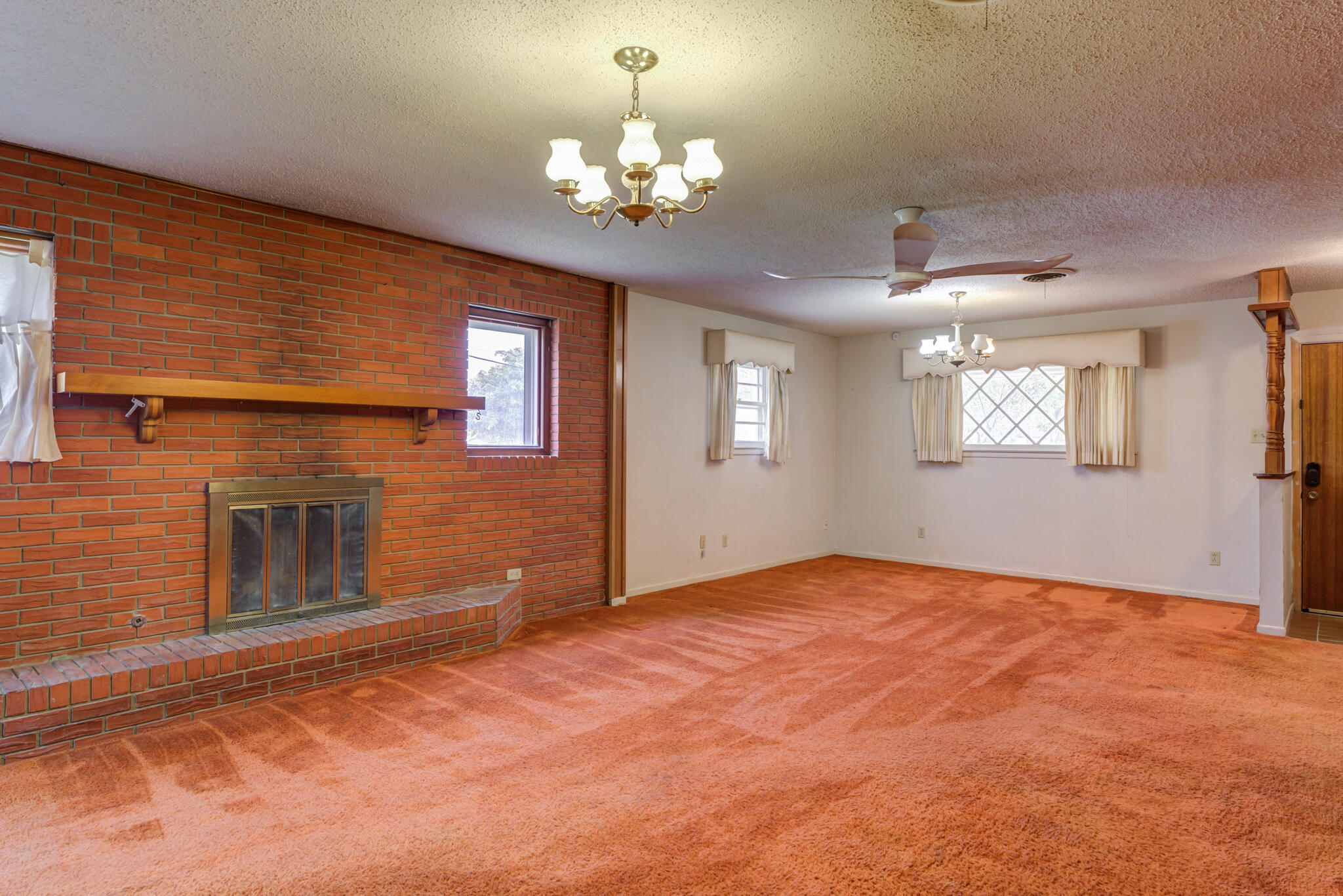 5502 8th Street Lubbock, TX 79416 - Photo 9 of 37 a view of an empty room with windows