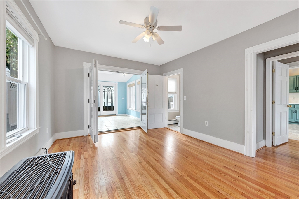7 Harold Avenue Gloucester, MA 01930 - Photo 24 of 42 a view of an empty room with wooden floor and a window