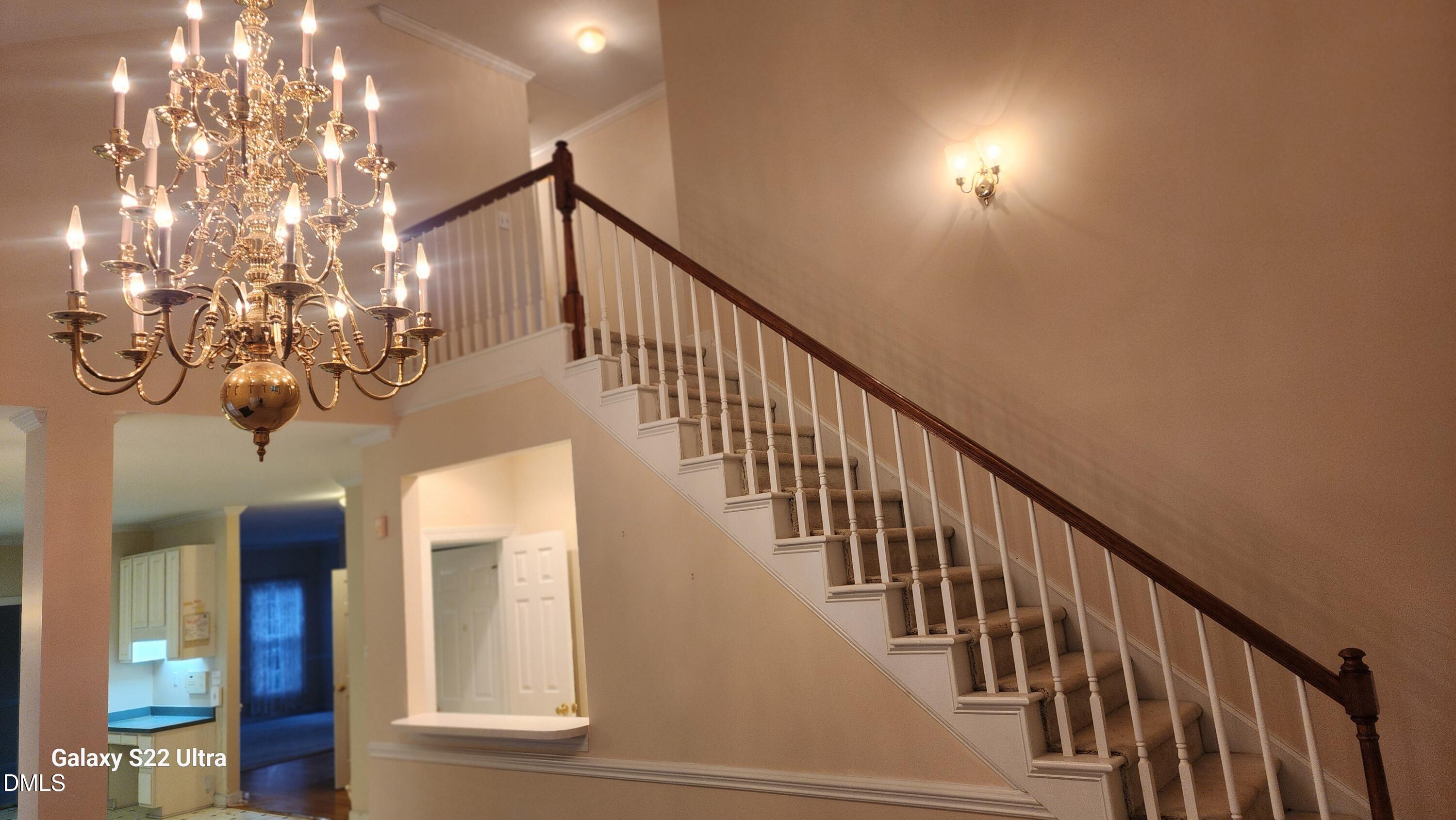 1 Haycox Court Durham, NC 27713 - Photo 37 of 91 a view of entryway and hall with a chandelier