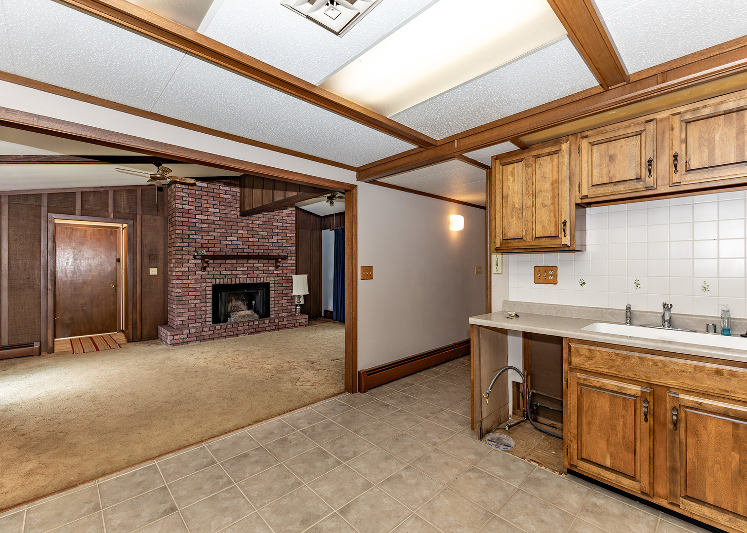420 Margaret Street Atkinson, IL 61235 - Photo 12 of 26 a kitchen with a sink cabinets and appliances