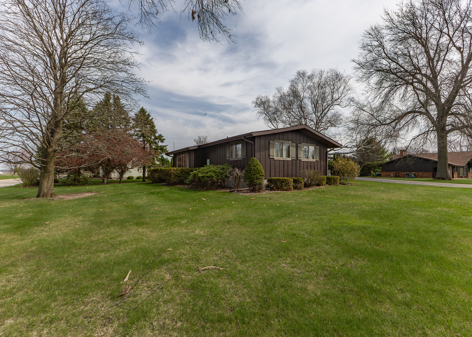 420 Margaret Street Atkinson, IL 61235 - Photo 3 of 26 a view of a big house with a big yard and large trees