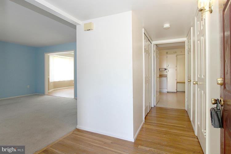 8955 Rolling Road Manassas, VA 20110 - Photo 2 of 30 a view of a hallway with wooden floor
