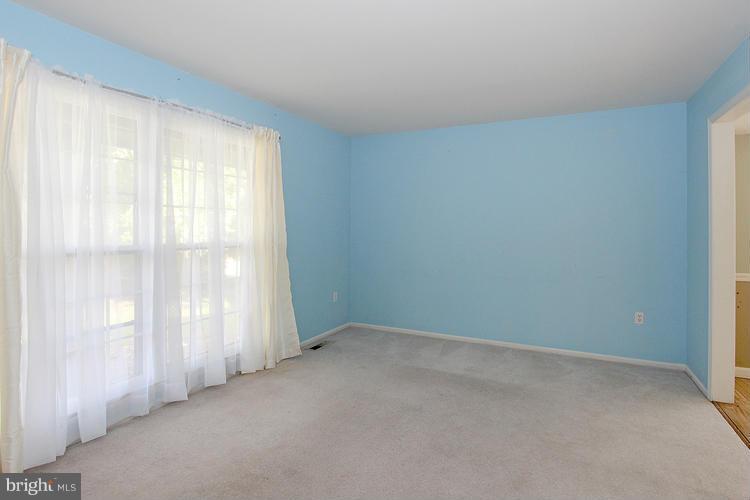 8955 Rolling Road Manassas, VA 20110 - Photo 3 of 30 a view of an empty room with a window