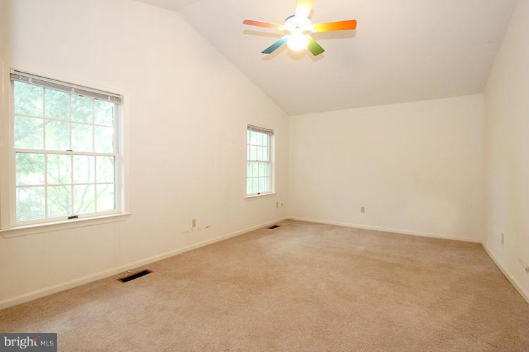 8955 Rolling Road Manassas, VA 20110 - Photo 22 of 30 an empty room with a window and a ceiling fan