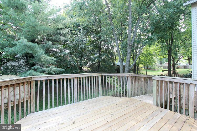 8955 Rolling Road Manassas, VA 20110 - Photo 27 of 30 a balcony with wooden floor and fence
