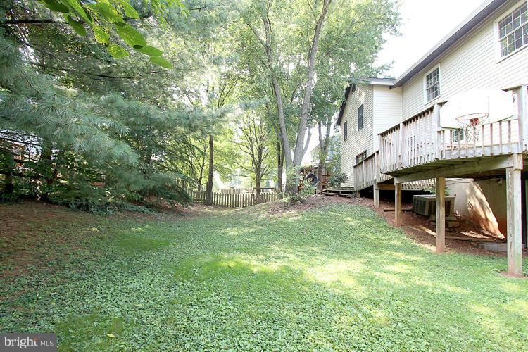 8955 Rolling Road Manassas, VA 20110 - Photo 29 of 30 a view of a house with a yard