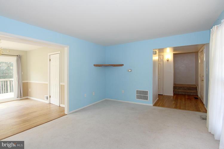 8955 Rolling Road Manassas, VA 20110 - Photo 4 of 30 a view of empty room with wooden floor