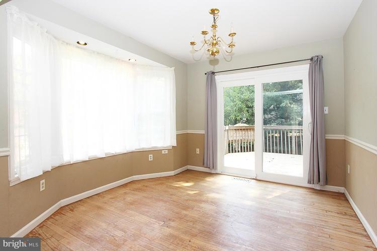 8955 Rolling Road Manassas, VA 20110 - Photo 5 of 30 a view of an empty room with a window