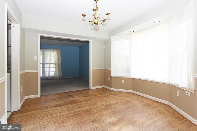 8955 Rolling Road Manassas, VA 20110 - Photo 6 of 30 a view of an empty room with a window