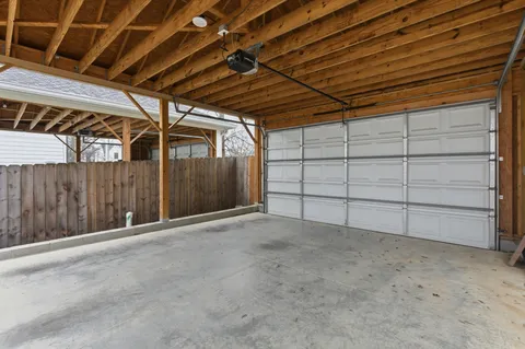 a view of a balcony with wooden floor and fence