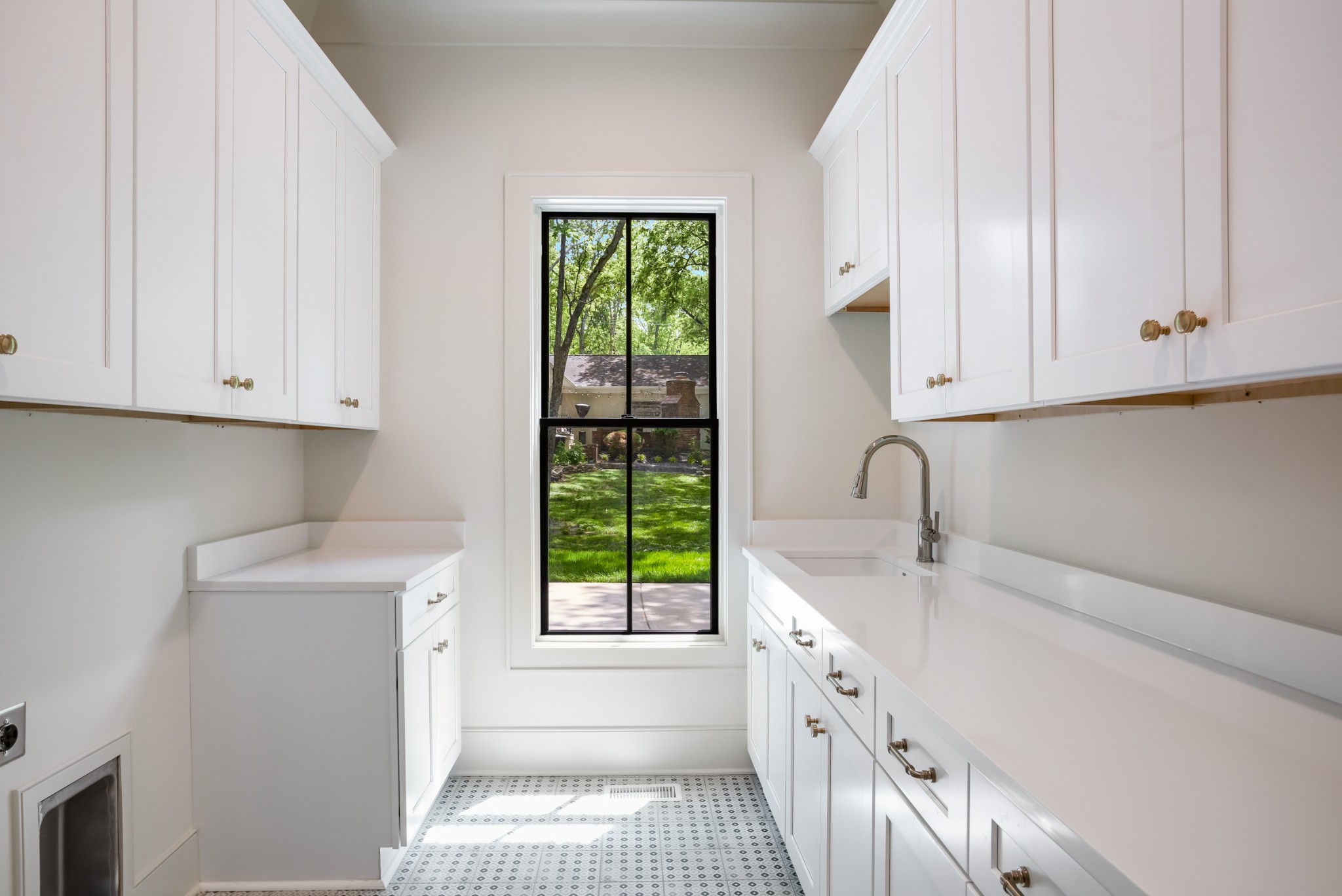 709 Brook Hollow Road Nashville, TN 37205 - Photo 27 of 55 a kitchen with a sink a window and cabinets