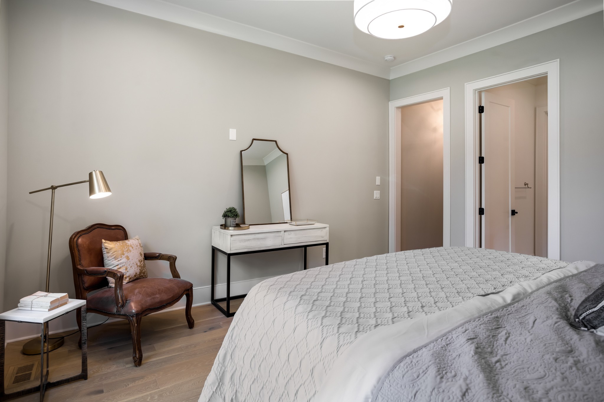 709 Brook Hollow Road Nashville, TN 37205 - Photo 29 of 55 a bedroom with a bed a chair and potted plant