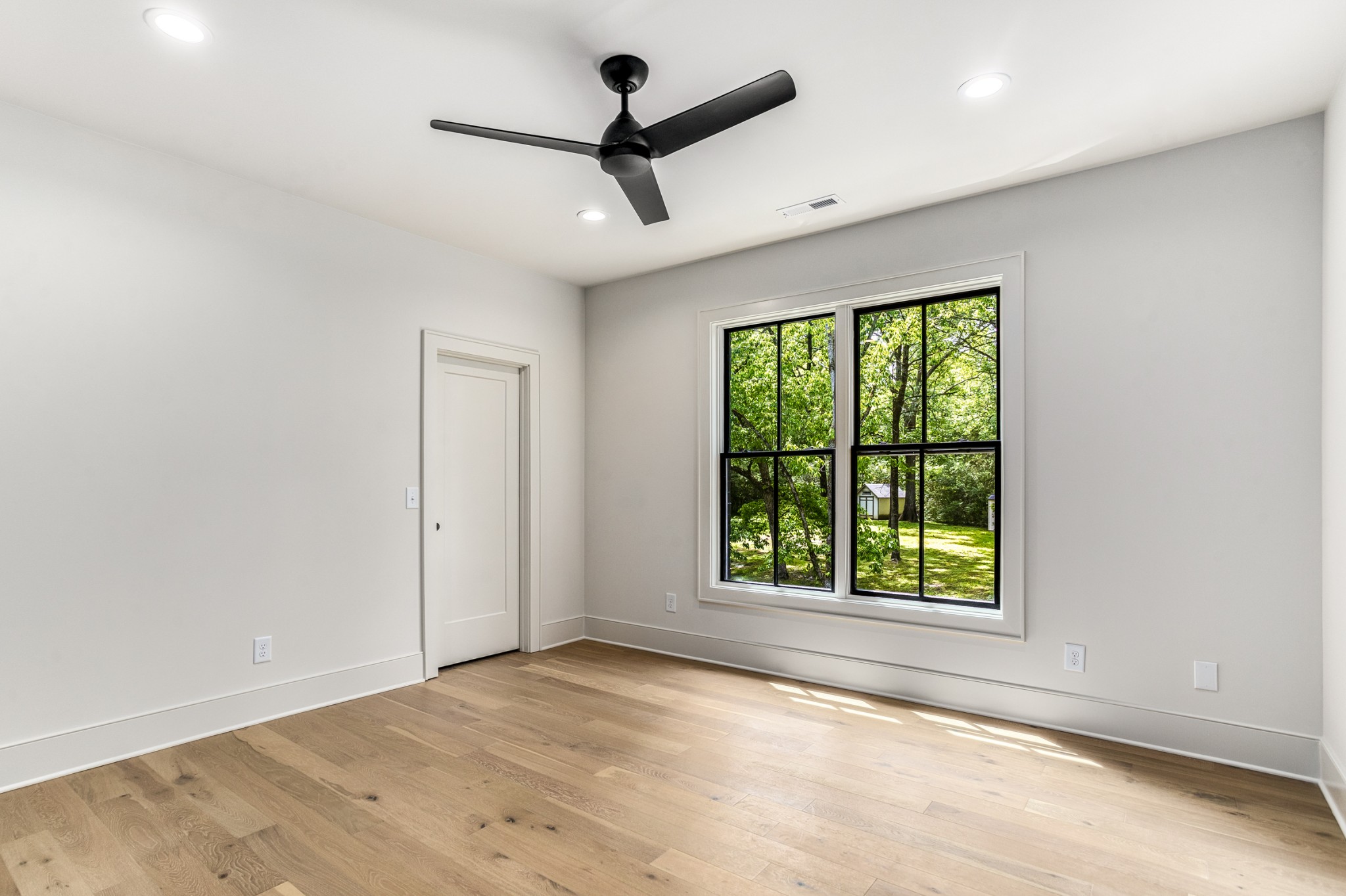 709 Brook Hollow Road Nashville, TN 37205 - Photo 38 of 55 wooden floor in an empty room with a window