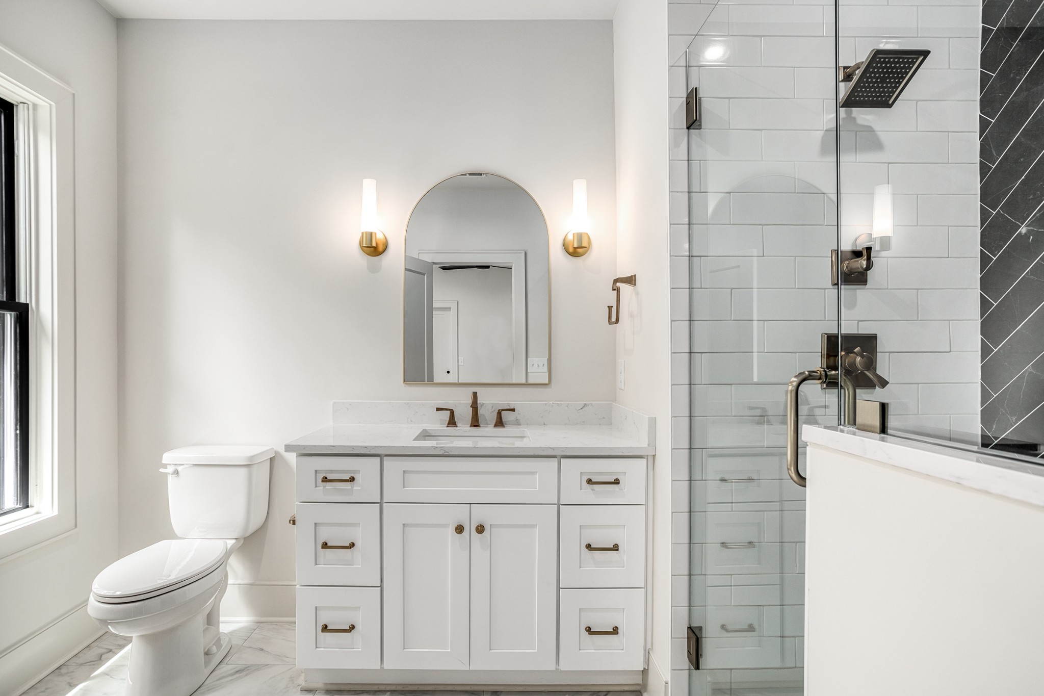 709 Brook Hollow Road Nashville, TN 37205 - Photo 39 of 55 a bathroom with a toilet sink double vanity and mirror