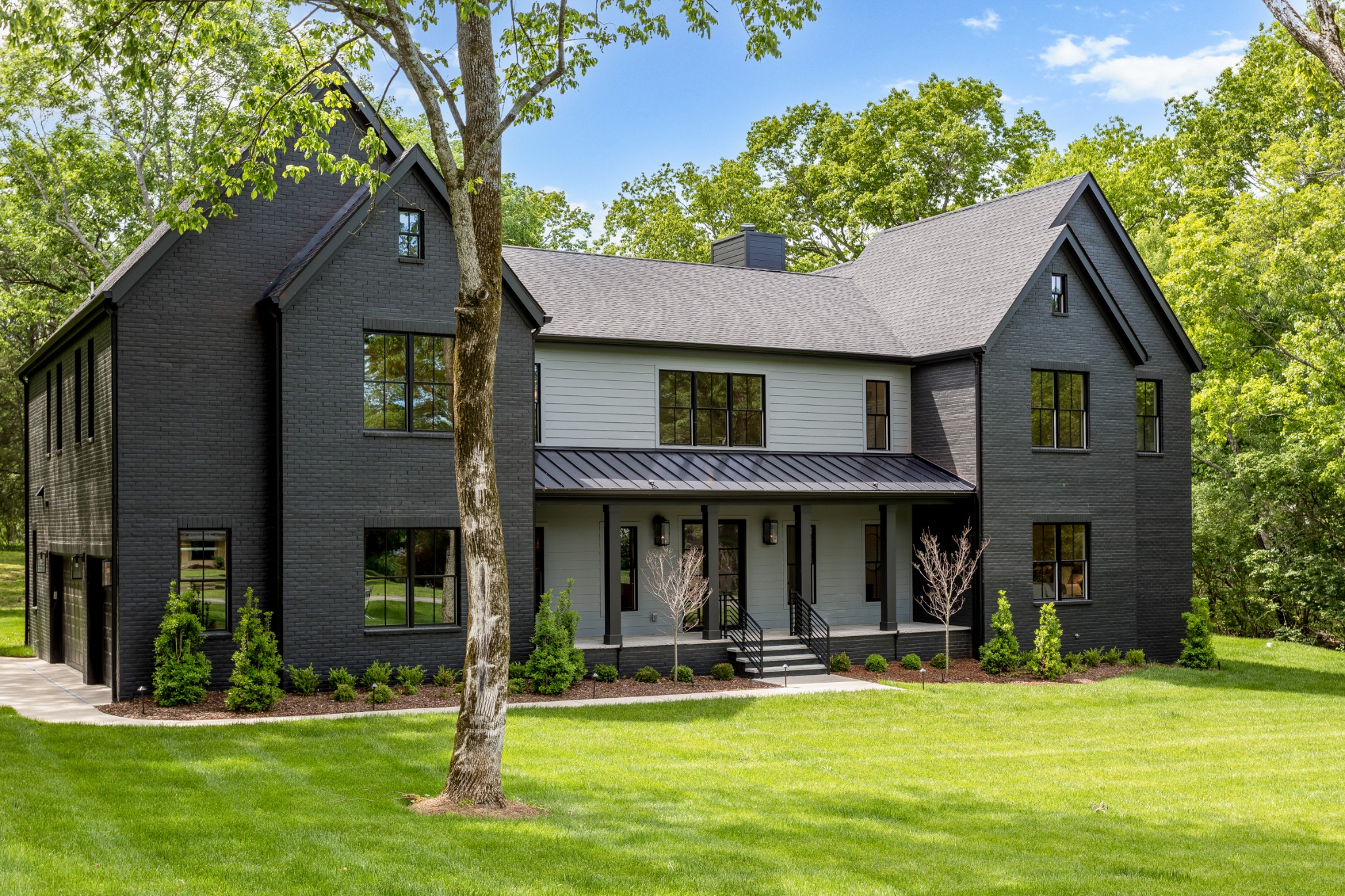 709 Brook Hollow Road Nashville, TN 37205 - Photo 4 of 55 a front view of a house with a yard