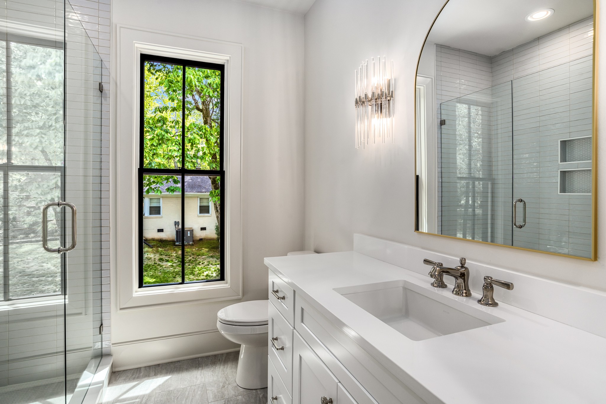 709 Brook Hollow Road Nashville, TN 37205 - Photo 43 of 55 a bathroom with a toilet a sink and a large mirror