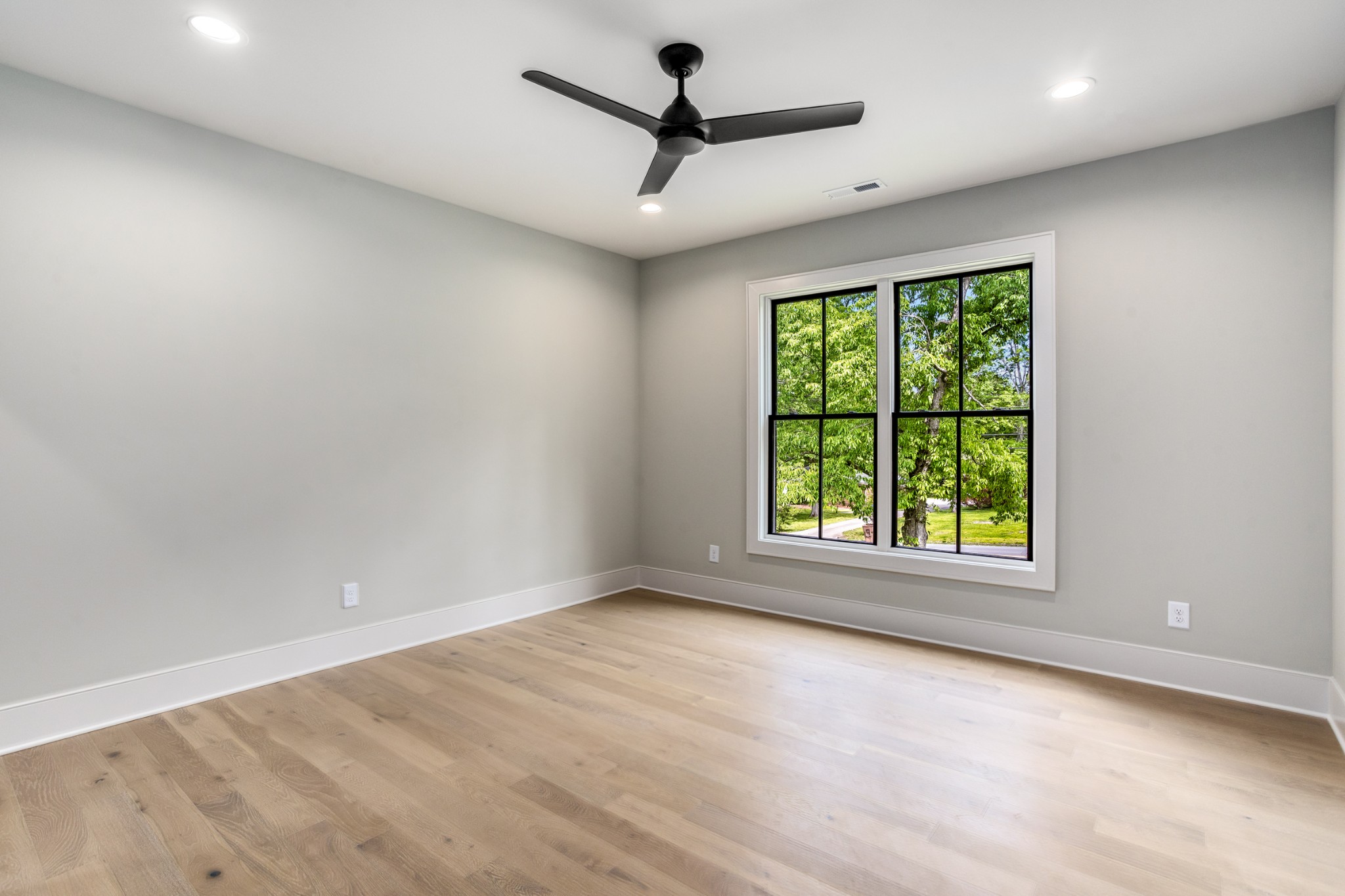 709 Brook Hollow Road Nashville, TN 37205 - Photo 44 of 55 an empty room with windows and ceiling fan