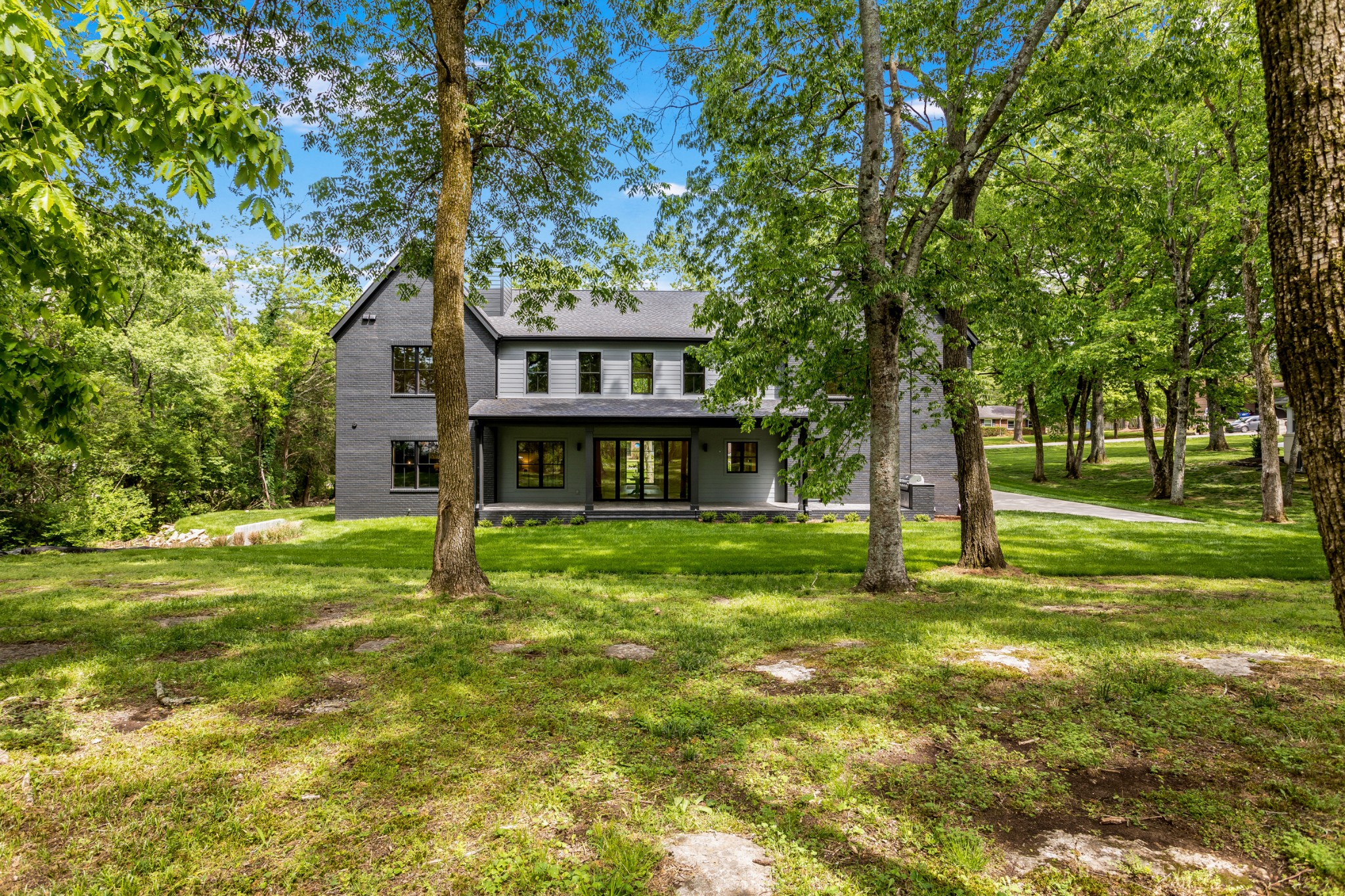 709 Brook Hollow Road Nashville, TN 37205 - Photo 53 of 55 a view of a house with a big yard plants and large trees