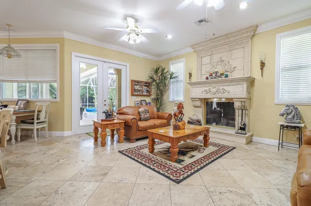 a living room with furniture and a fireplace