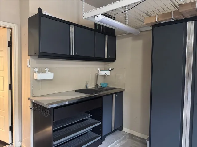 a kitchen with stainless steel appliances granite countertop a stove and a microwave with wooden floor
