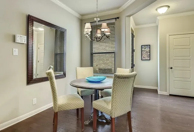a view of a dining room with furniture and window
