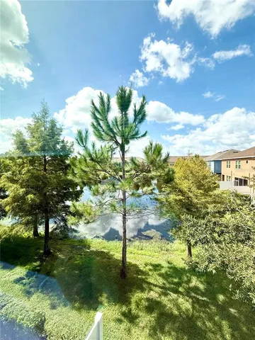 a large bathroom with a granite countertop sink a toilet a mirror and a shower