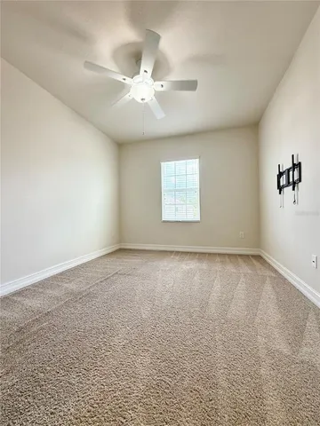 a bathroom with a granite countertop sink toilet a mirror and bathtub
