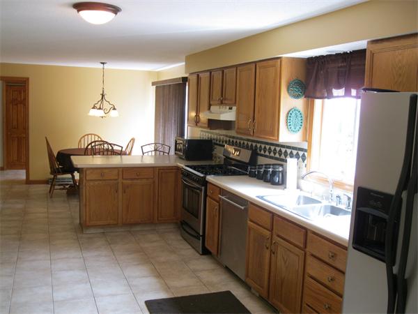 83 Pequot Road Southampton, MA 01073 - Photo 4 of 23 a kitchen with a sink refrigerator and microwave